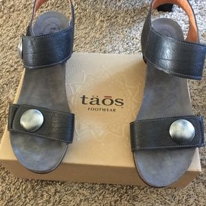 TÄŌS wedge sandals.